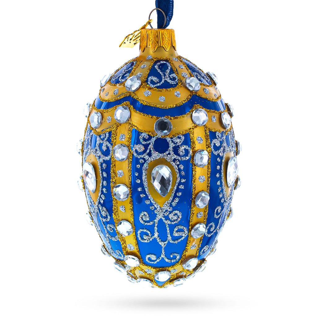 Glass White Scrolls on Blue Glass Egg Ornament 4 Inches in Multi color Oval