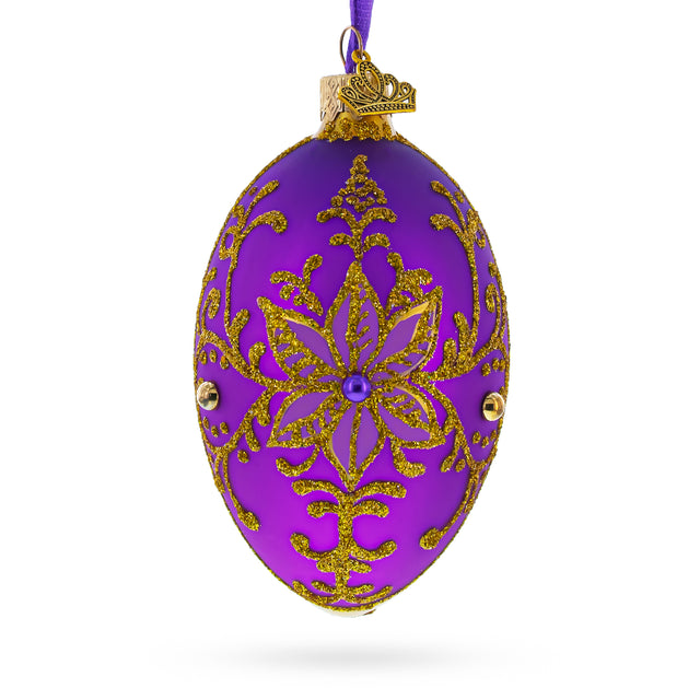 Golden Swirls on Purple Glass Egg Ornament 4 Inches in Purple color Oval
