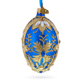 Golden Swirls on Blue Glass Egg Ornament 4 Inches in Blue color Oval