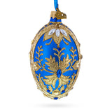 Golden Swirls on Blue Glass Egg Ornament 4 Inches in Blue color Oval