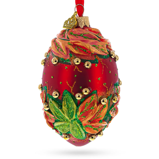Red and Green Leaves on Red Glass Egg Ornament 4 Inches in Red color, Oval shape