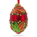 Red and Green Leaves on Red Glass Egg Ornament 4 Inches in Red color Oval