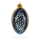 Daisy Motif with Golden Accents and Crystals Glass Egg Ornament in Black color Oval