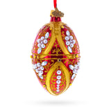 Regal Red and Gold Filigree with Pearls Glass Egg Ornament 4 Inches in Red color Oval