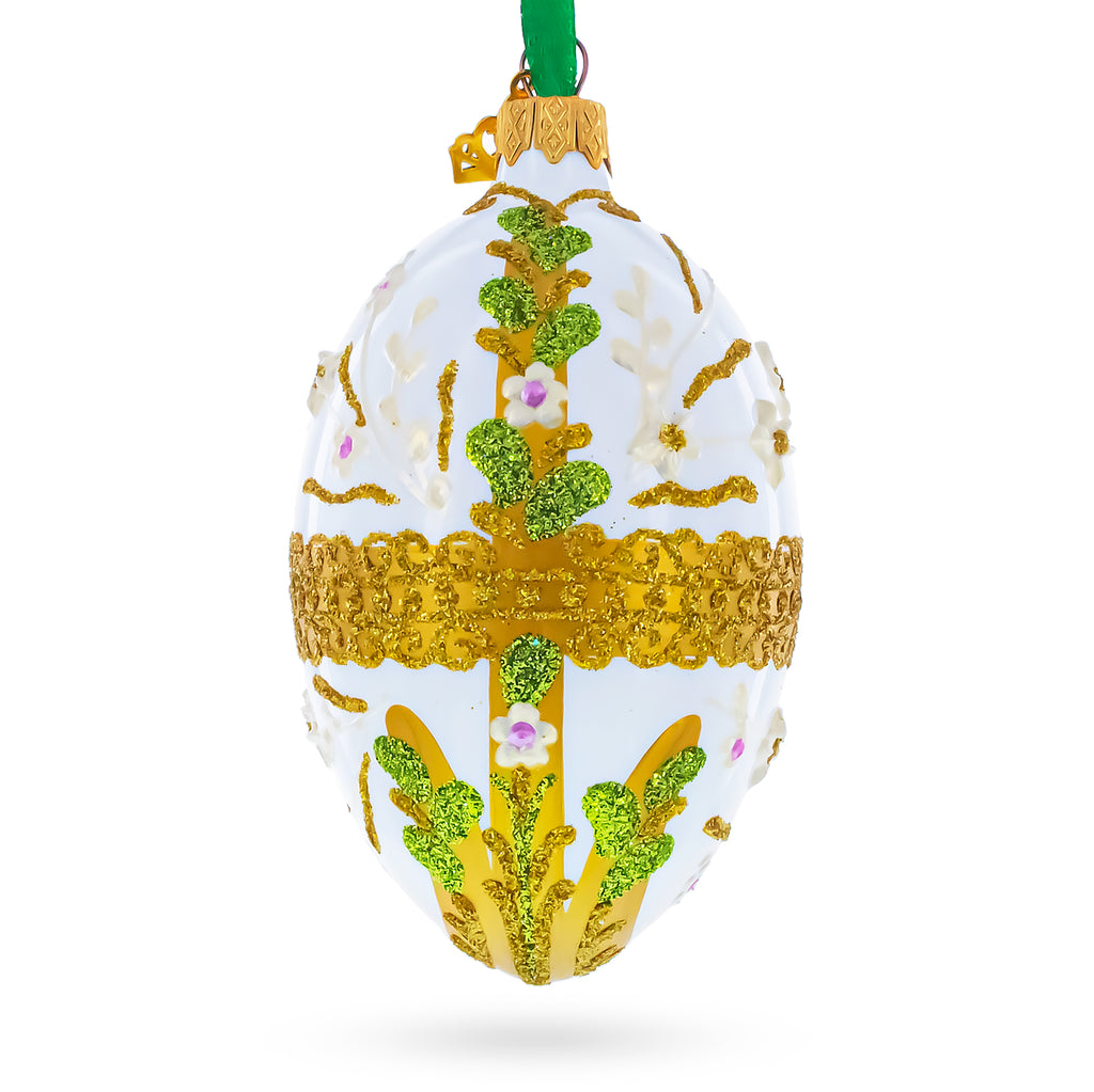 Gold Glitter Scrolls, Green Leaves, and Ivory Flowers on White Glass Egg Ornament 4 Inches in White color Oval