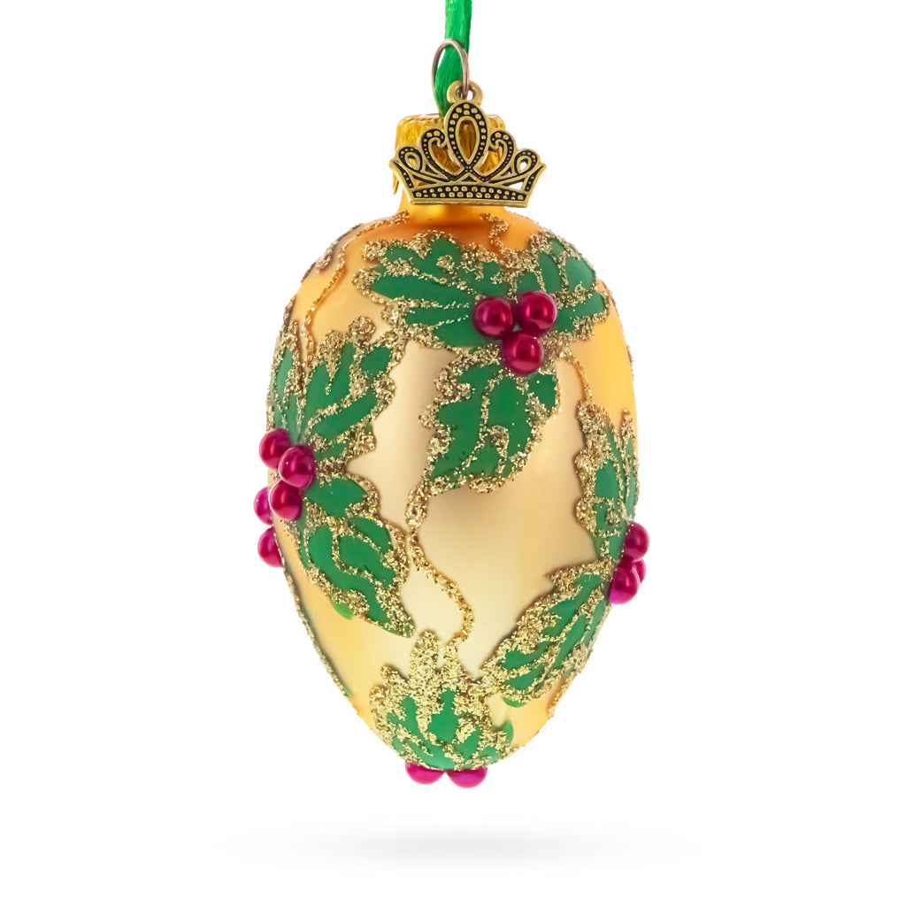Golden with Holly Leaf and Red Berry Accents Mini Glass Egg Ornament 2.9 Inches in Gold color Oval