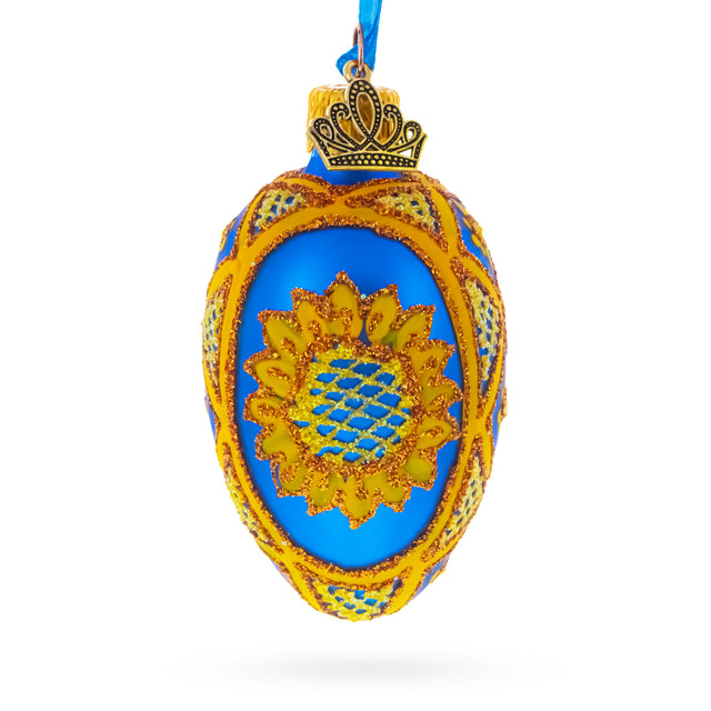 Cobalt Blue with Yellow Sunflower and Red Glitter Accents Mini Glass Egg Ornament 2.9 Inches in Blue color Oval