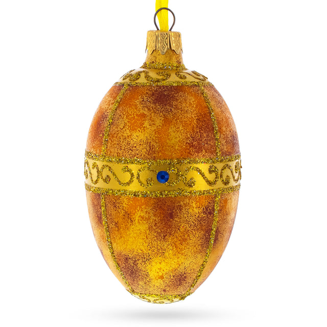 1917 Karelian Birch Royal Egg Glass Ornament 4 Inches in Gold color, Oval shape