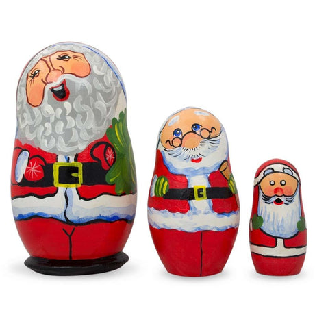 Wood Set of 3 Smiling Santa Claus Figurines Wooden Nesting Dolls 4.25 Inches in Multi color