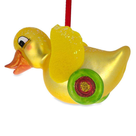 Yellow Duck Rolling on Wheels - Blown Glass Christmas Ornament in Yellow color,  shape