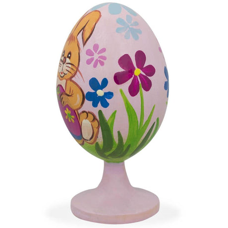 Bunny Decorating Easter Egg Wooden FigurineUkraine , dimensions in inches: 3.5 x 4.6 x 1.34