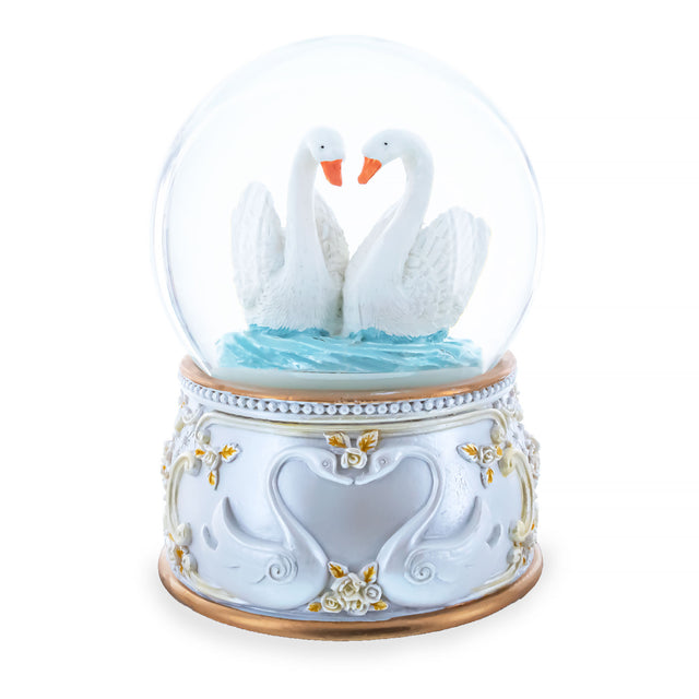 Enchanted Swans Spinning Musical Water Snow Globe in White color Round