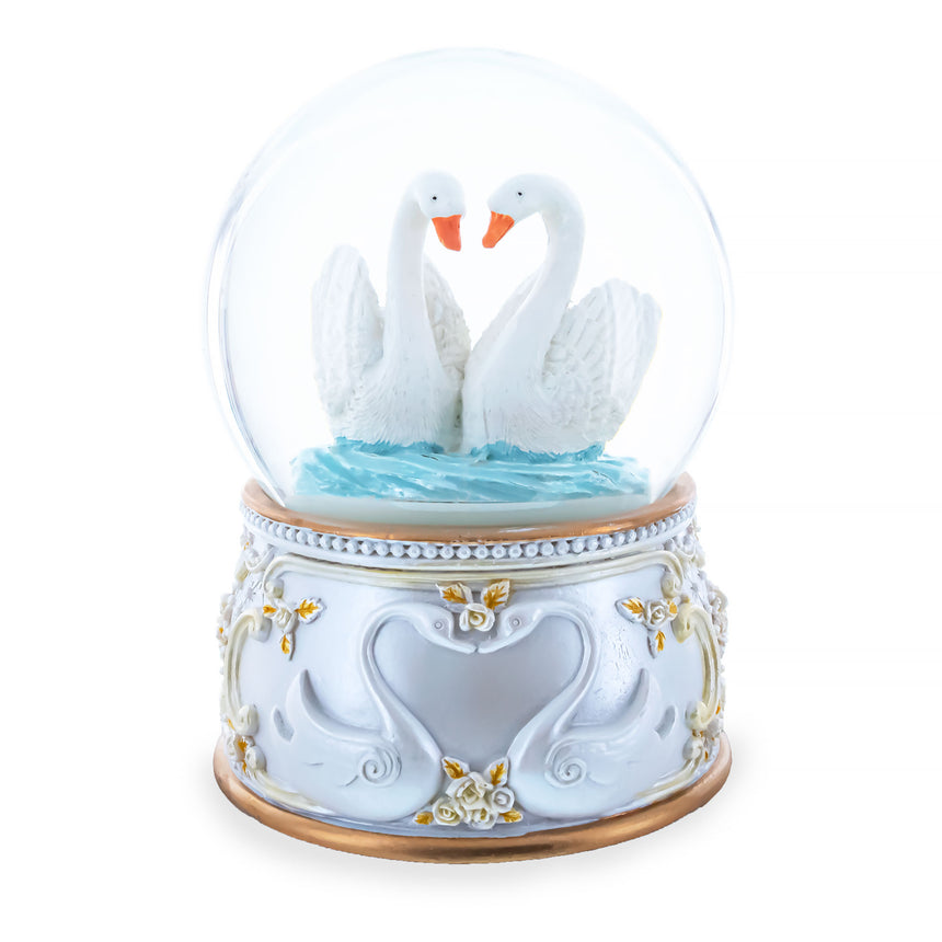 Enchanted Swans Spinning Musical Water Snow Globe in White color Round