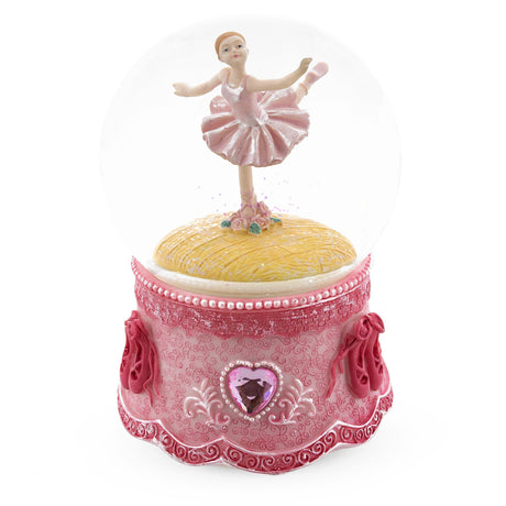 Graceful Pirouette: Pink Ballerina in Enchanting Spin - Musical Water Snow Globe in Pink color, Round shape