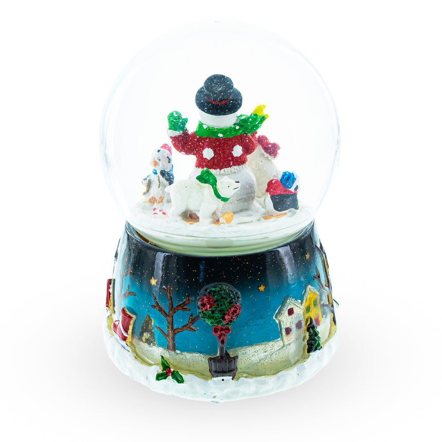 Snowman, Polar Bears, and Penguins Musical Spinning Snow Globe , dimensions in inches: 5.5 x 4 x 4