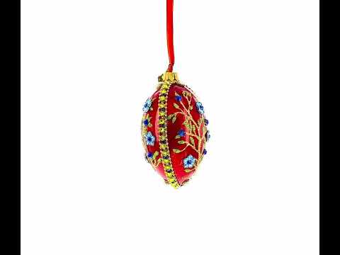 Blaue, juwelenbesetzte Blumen auf rotem Glasei, 10 cm