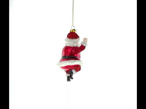 Santa Boogying in Festive Red Attire Glass Christmas Ornament