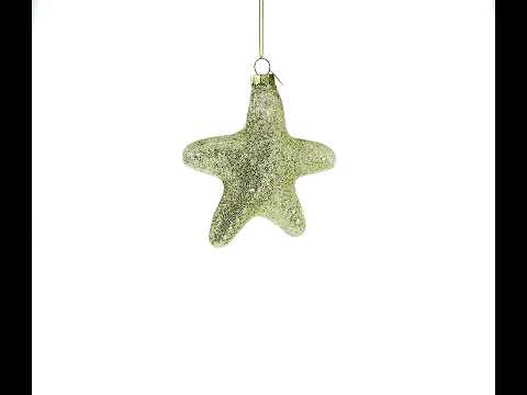Adorno navideño de vidrio soplado con la palabra Joy en forma de estrella dorada y brillante