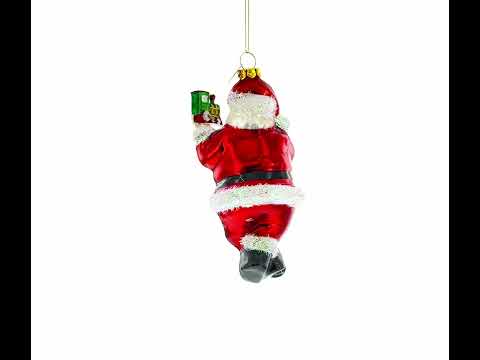 Santa Decorating the Train Glass Christmas Ornament