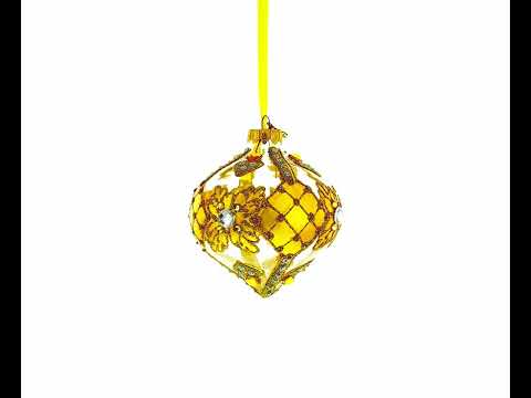 Adorno navideño de vidrio transparente con hojas doradas enjoyadas y remate en forma de cebolla