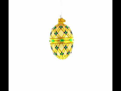 Gelbes Gittermuster, grüne Schmucksteine ​​und königsblaue Akzente, Glas-Ei-Ornament, 10 cm