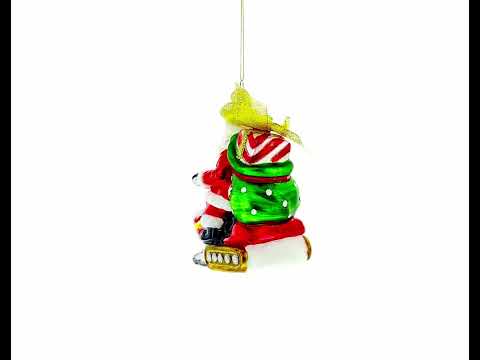 Santa Delivering Gifts on a Snowmobile Glass Christmas Ornament