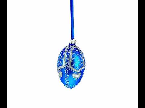 Perlen auf blauem Glasei-Ornament, 10 cm