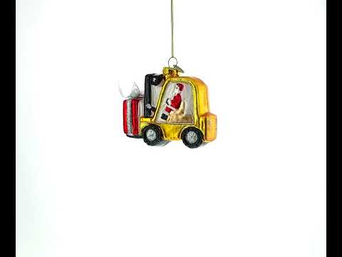 Weihnachtsmann liefert Geschenke mit einem Gabelstapler aus Glas