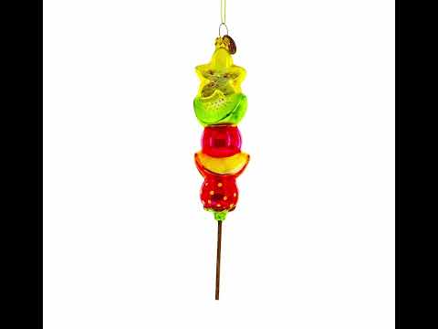 Adorno navideño de vidrio con mezcla de frutas en un palito