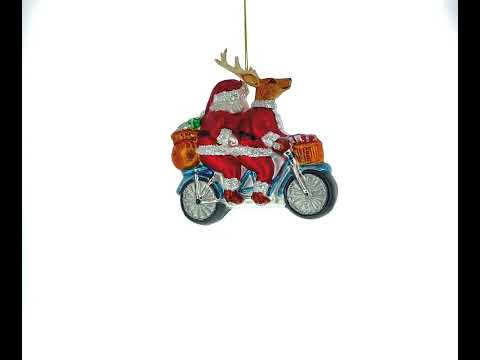 Santa and Reindeer Riding a Tandem Bike Glass Christmas Ornament