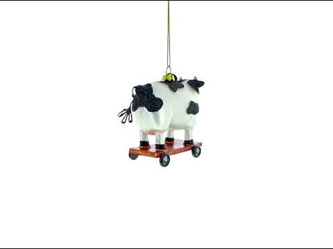 Spotted Cow Ice Skating Glass Christmas Ornament