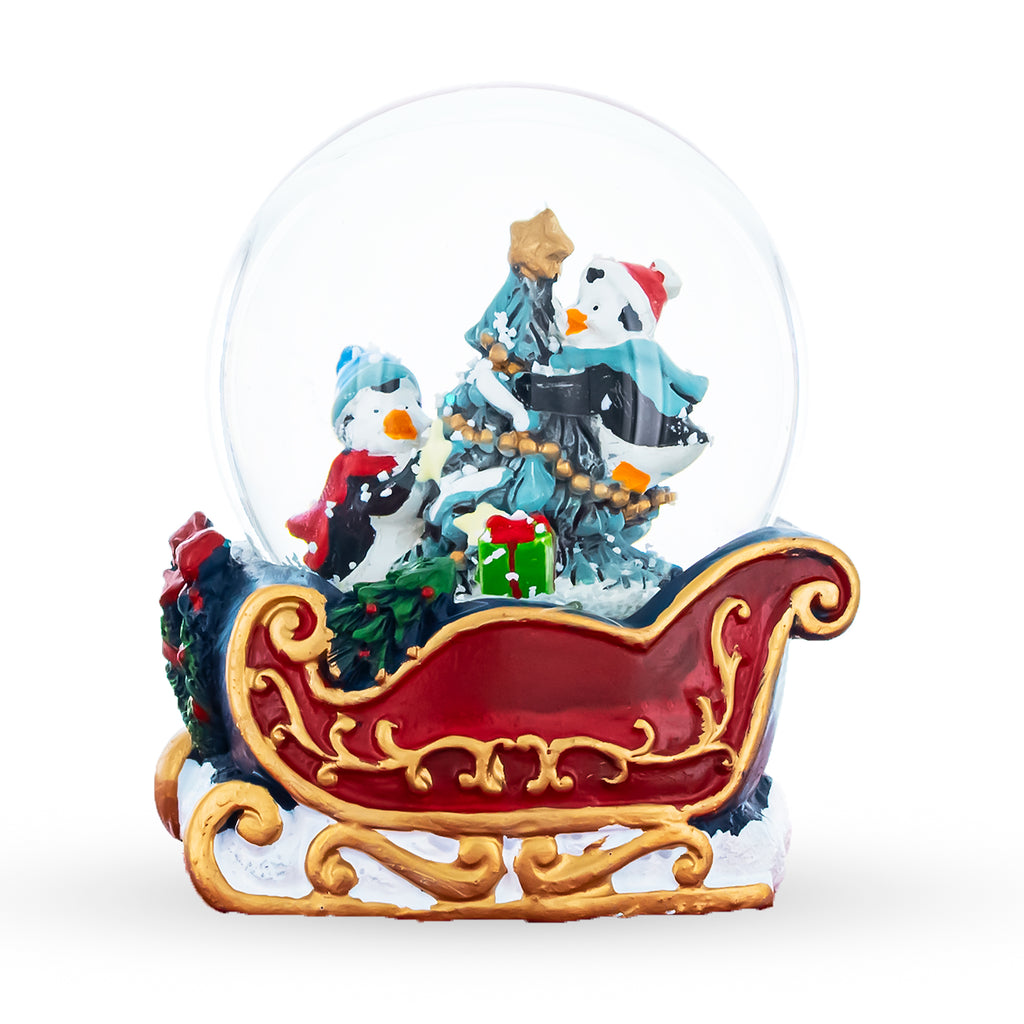 Penguin Sleigh Ride: Mini Water Snow Globe with Penguins Decorating Tree by BestPysanky