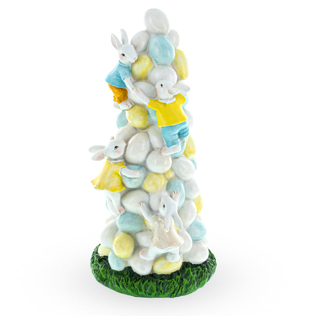 Resin Easter Ascent: Bunnies Climbing Easter Egg Tree Figurine in Multi color