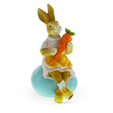 Springtime Serenity: Mother Bunny Cradling Carrot Atop a Decorative Easter Egg Figurine ,dimensions in inches: 5.2 x 2.9 x 2.5