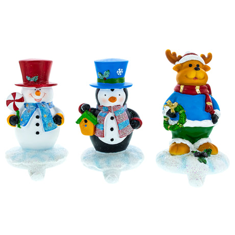 Winter Wonderland Trio: Set of 3 Christmas Stocking Holders - Snowman, Penguin, and Reindeer in Multi color,  shape