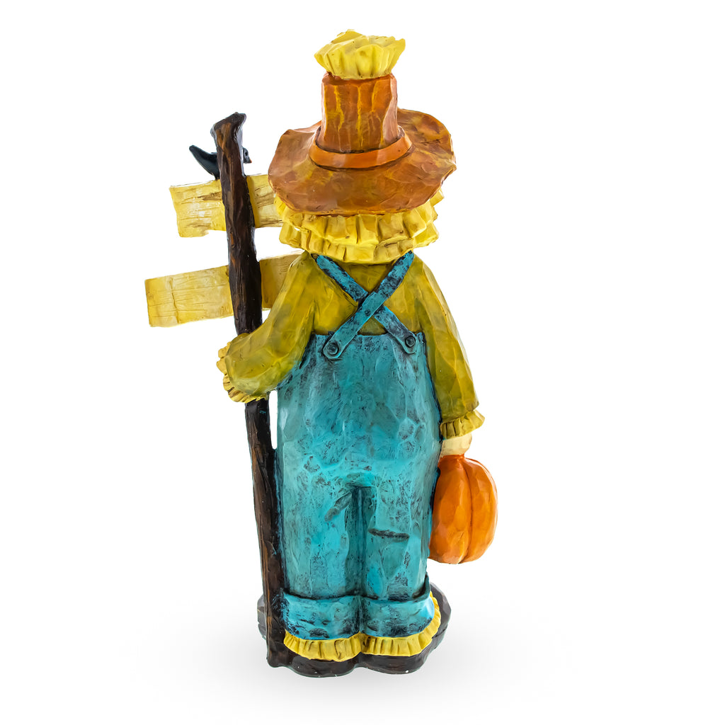 Friendly Scarecrow Holding Happy Thanksgiving Sign FigurineChina , dimensions in inches: 10.2 x 4.9 x 2.6