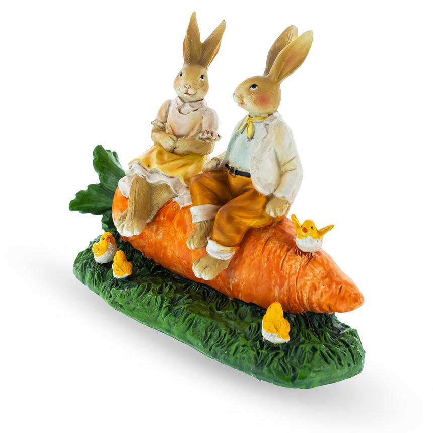 Bunny Couple in Love Sitting on a Carrot Figurine , dimensions in inches: 7.7 x 6.3 x 3.4