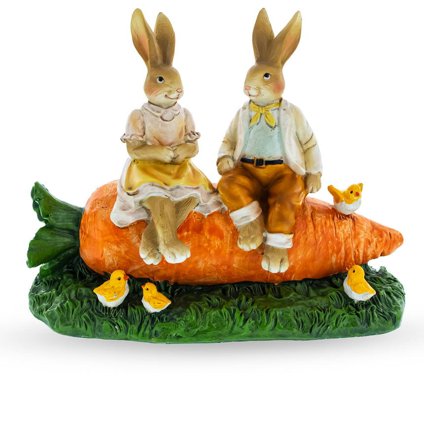 Bunny Couple in Love Sitting on a Carrot Figurine in Multi color